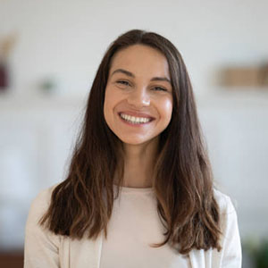 Head shot profile picture of smiling attractive mixed race woman. Happy caucasian girl looking at camera, enjoying communicating with friends via video call, female client satisfied with service.